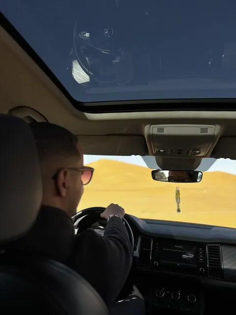 Abdel driving toward the Sahara dunes during a private Morocco journey